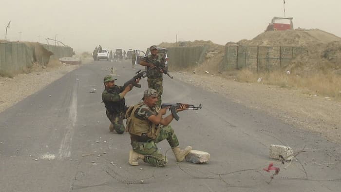 Shia militia fighters loyal to cleric Muqtada Sadr on patrol in Salahuddin province in Northern Iraq.